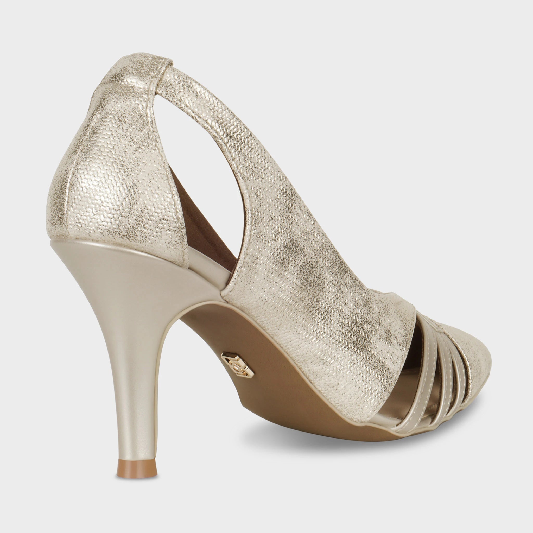 Rear view of Altavie gold pumps showing the smooth tapered stiletto heel, textured shimmer upper wrapping around the heel counter, Glentè logo on the outsole, and cage toe detail — Glentè