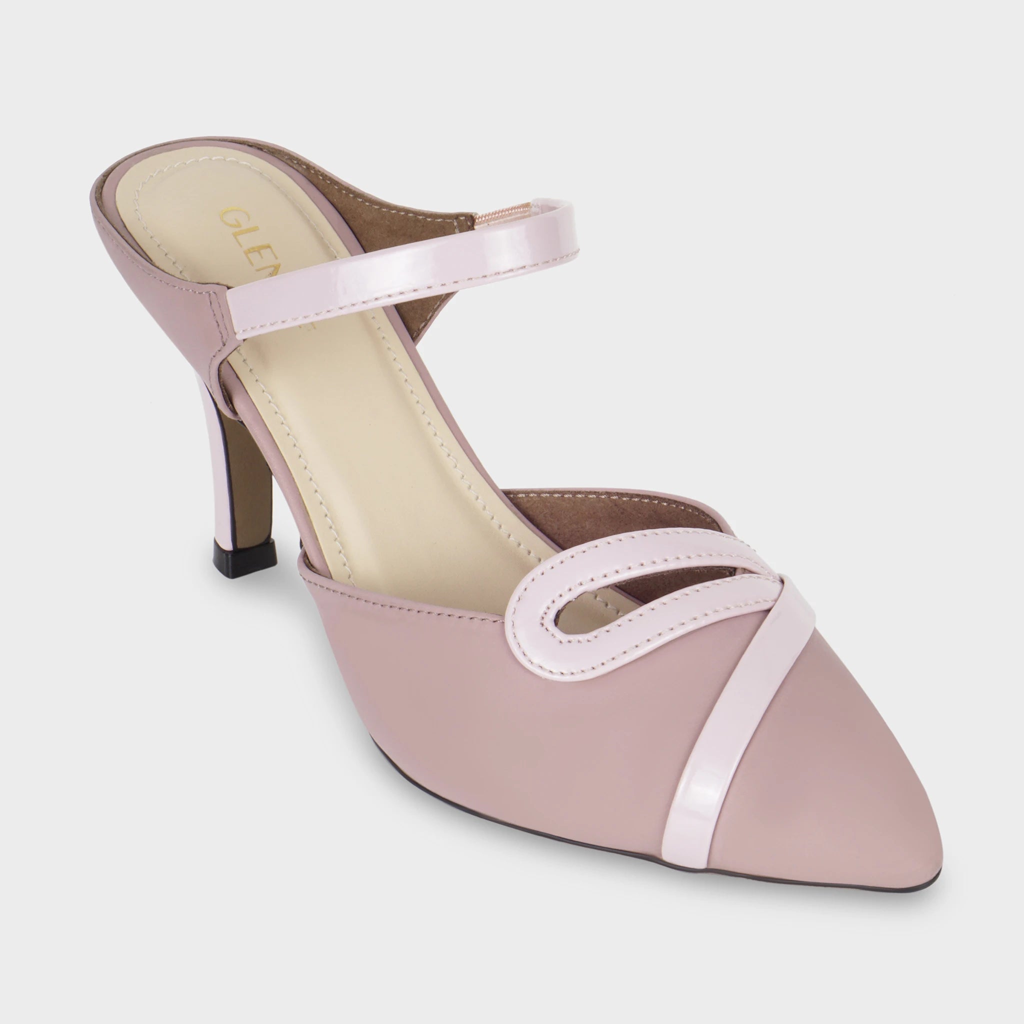 Front angled view of Eloura woodrose heeled ankle strapped pump highlighting the sharp pointed toe, patent teardrop loop detail, diagonal patent trim across the vamp, and gold Glentè branding on the cream insole