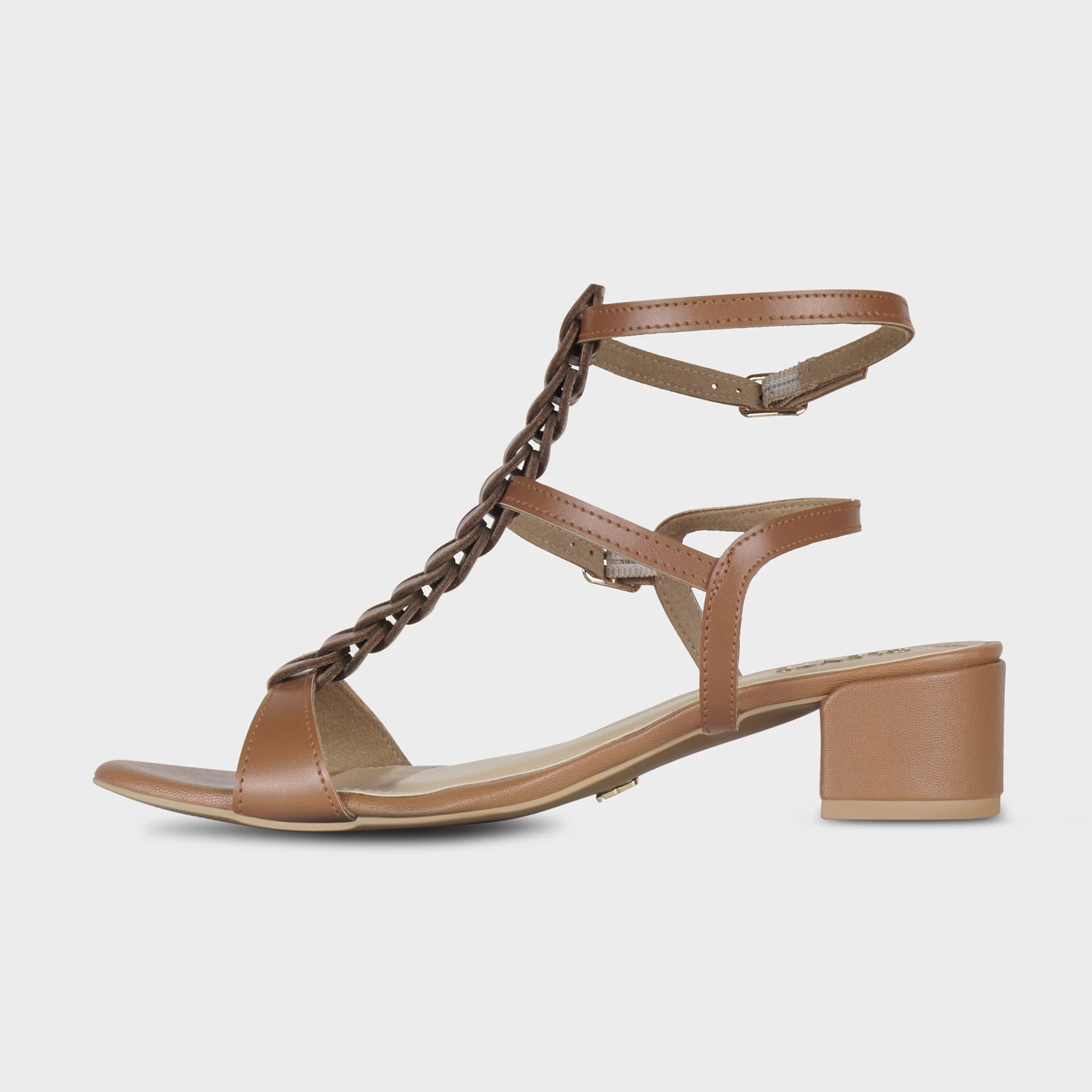 Inner side view of brown Marvea gladiator sandals showing the braided centre column, double ankle straps with gold buckles, and rounded block heel with Glentè branding - Glentè