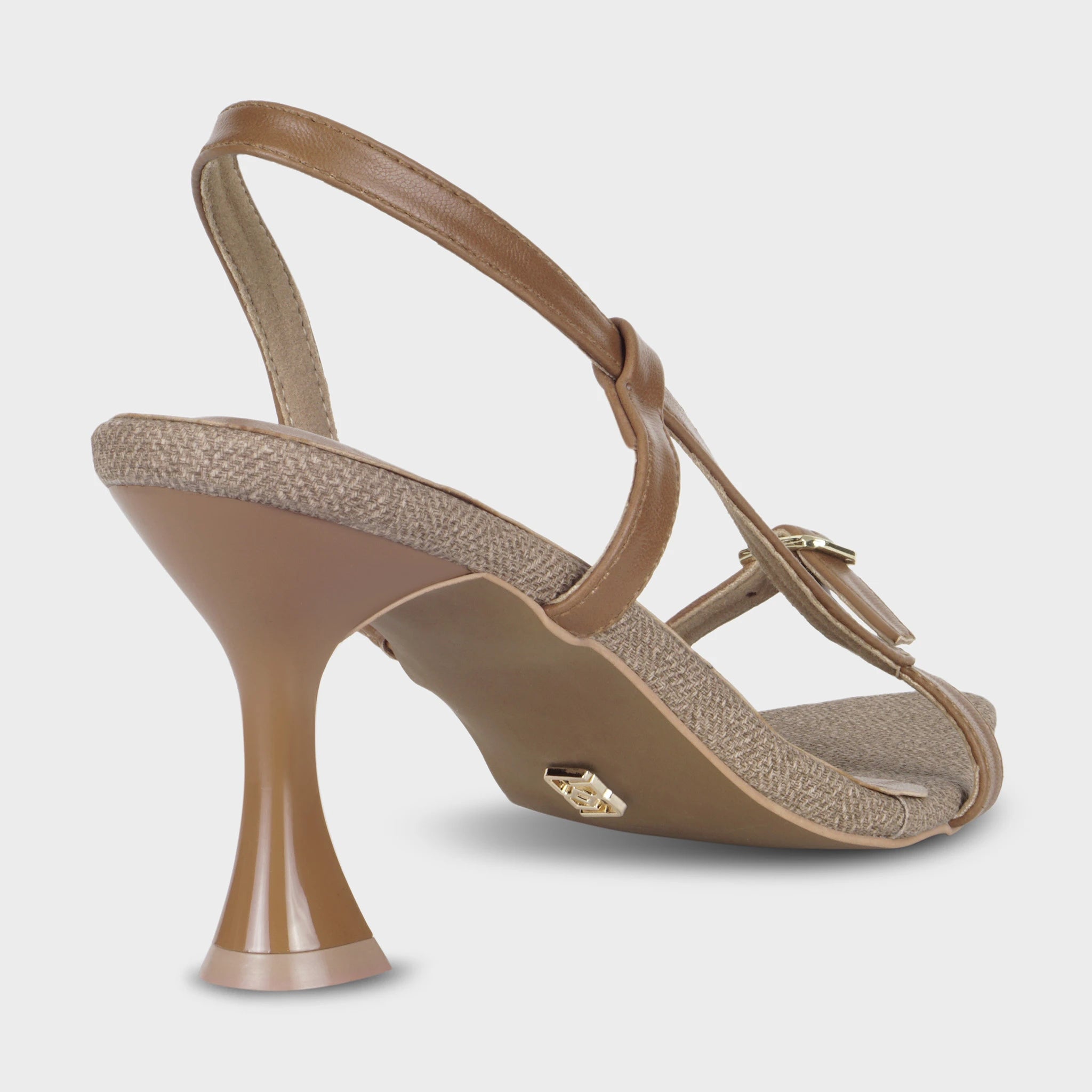 Glentè Sivelle brown sandal rear view - open slingback strap, flared heel base, gold logo charm on heel counter, woven upper edge piping
