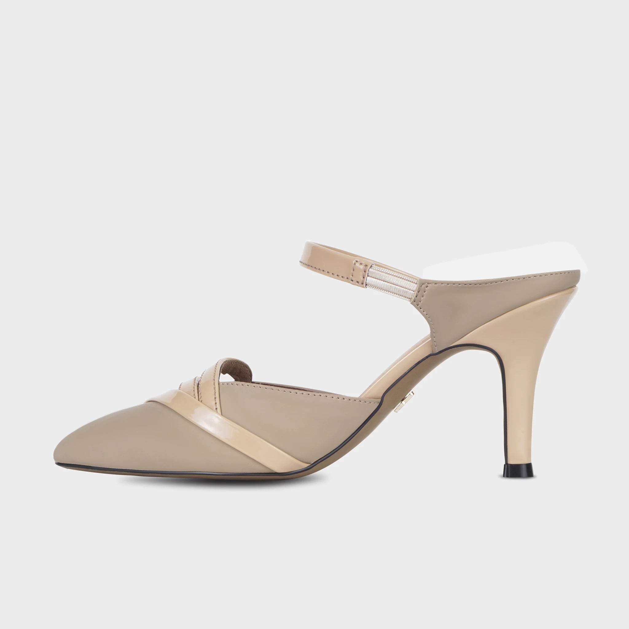 Inner side view of taupe Eloura heeled ankle strapped pump displaying the clean pointed silhouette, patent teardrop loop accent, glossy instep band, and elegant tapered heel - Glentè
