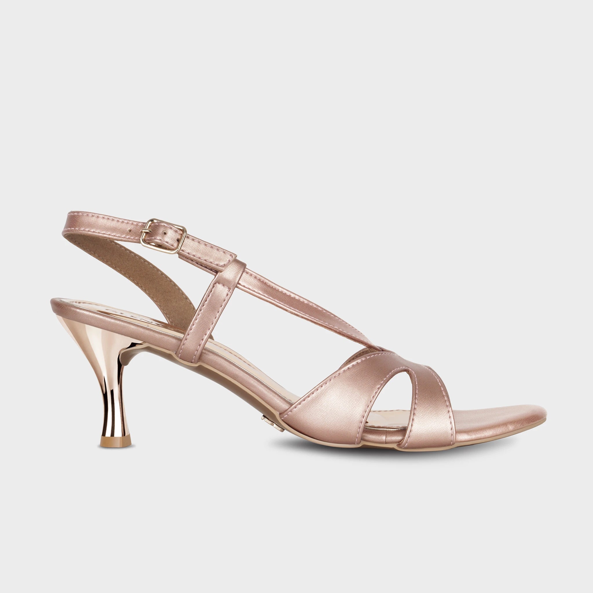 Rose gold slingback heels with crossover straps, adjustable buckle closure, and a sculptural flared rose gold metallic spool heel - Glentè Orisea