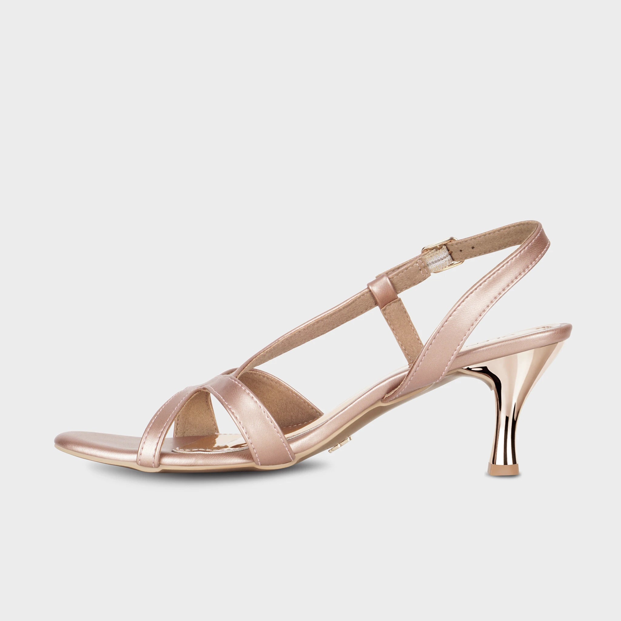 Inner side view of rose gold Orisea slingback heels showing the asymmetric strap layout and polished rose gold spool heel — Glentè