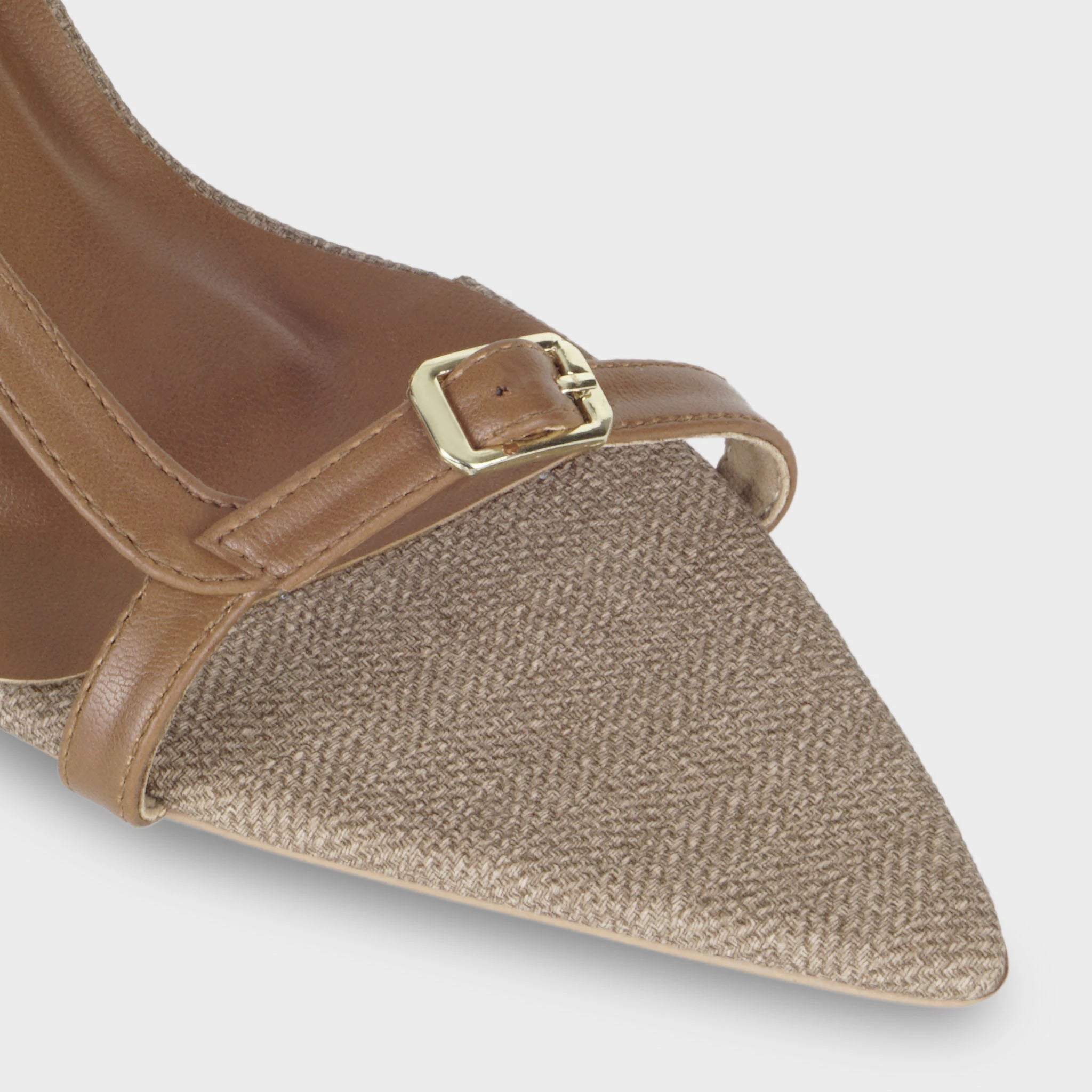 Glentè Sivelle sandal close-up - herringbone woven fabric pointed toe, adjustable tan strap with gold buckle hardware